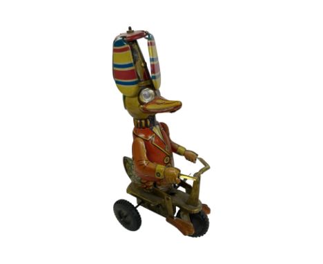 Vintage tinplate Schylling duck on a tricycle.  Condition report. GWO.