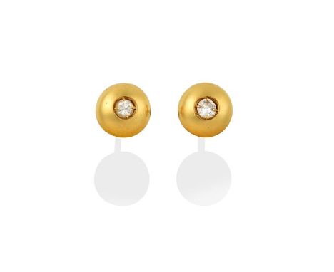 A Pair of Diamond Solitaire Earrings, the eight-cut diamonds inset within a yellow dome, total estimated diamond weight 0.10 