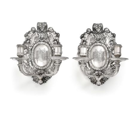 A Pair of George V Silver Two-light Wall-Sconces, by Charles and Richard Comyns, London, 1925, in the late 17th century style