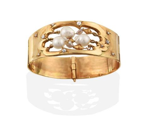 A 9 Carat Gold Baroque Cultured Pearl and Diamond Bangle, the central openwork section suspended with baroque cultured pearls