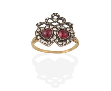 A 19th Century Garnet and Diamond Twinned Heart Ring, the heart shaped cabochon garnets within a rose cut diamond border, sur