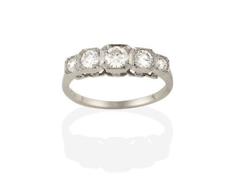 A Diamond Five Stone Ring, the graduated round brilliant cut diamonds in white square millegrain settings, to a tapered shoul