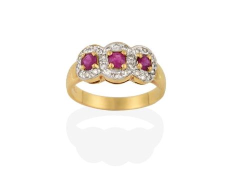 A Ruby and Diamond Triple Cluster Ring, the round cut rubies in yellow claw settings, within borders of eight-cut diamonds in