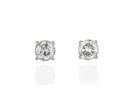 A Pair of Diamond Solitaire Earrings, the round brilliant cut diamonds in white four claw settings, total estimated diamond w