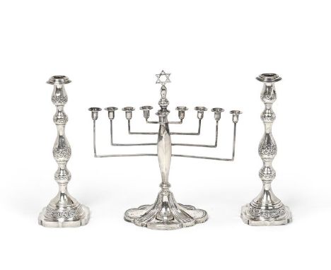 A George V Silver Hanukkah Menorah and a Pair of Sabbath Candlesticks, the Menorah by Britton, Gould and Co., Birmingham, 193
