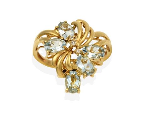 A 9 Carat Gold Aquamarine Ring, the floral motif set throughout with oval cut aquamarines and round brilliant cut diamonds, i