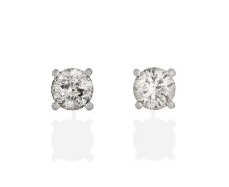 A Pair of Diamond Solitaire Earrings, the round brilliant cut diamonds in white four claw settings, total estimated diamond w