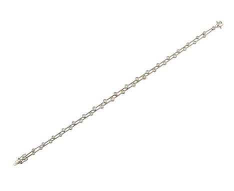 An 18 Carat White Gold Diamond Double Row Bracelet, formed of round brilliant cut diamonds in rubbed over settings, spaced by