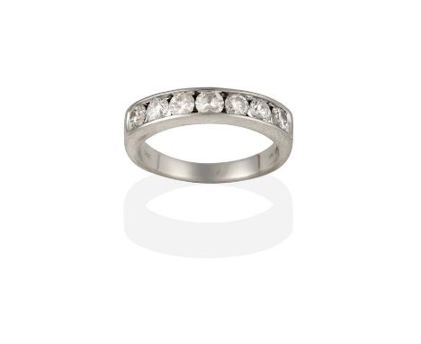 An 18 Carat White Gold Diamond Half Hoop Ring, the round brilliant cut diamonds in channel settings, to a plain polished shan