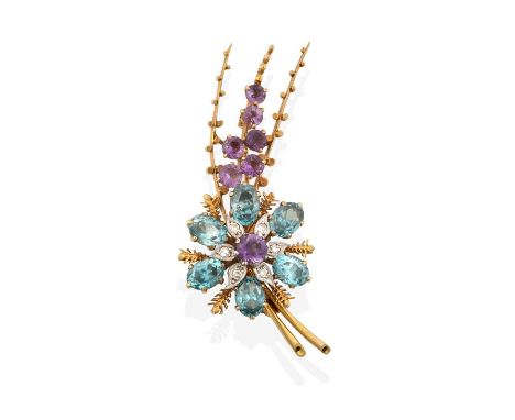 A 9 Carat Gold Blue Zircon, Amethyst and Diamond Brooch, the floral spray motif set throughout with oval cut blue zircons, ro