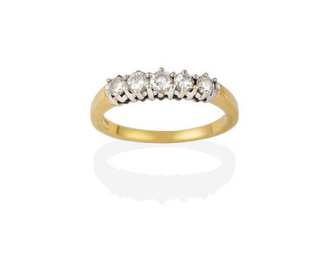 An 18 Carat Gold Diamond Five Stone Ring, the round brilliant cut diamonds in white claw settings, to a yellow tapered should