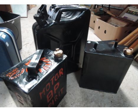 A jerry can and two vintage petrol cans shell and BP
