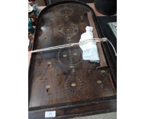 A vintage wooden Bagatelle board with ball bearings