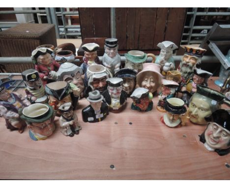 A large collection of character jugs large and medium size including Sylvac, Carltonware and Wood & son 