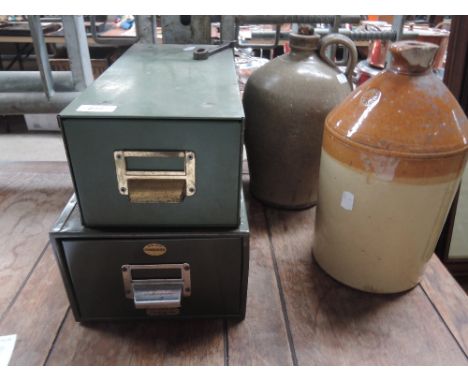Two vintage stoneware bottles and filing trays