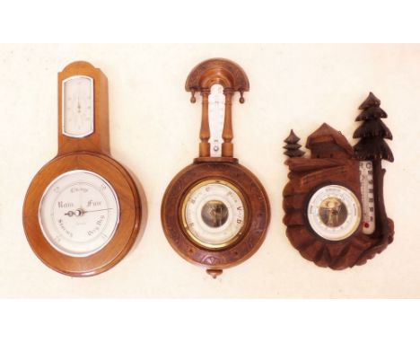 A Smith's 'Barotherm' barometer and two carved barometers