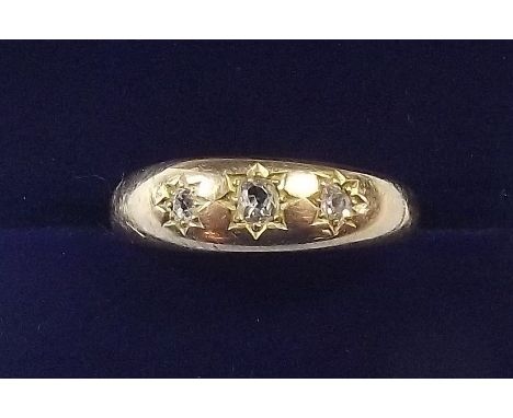 A Victorian 15 carat gold gypsy ring with three diamonds in star settings - size P - 3.8g