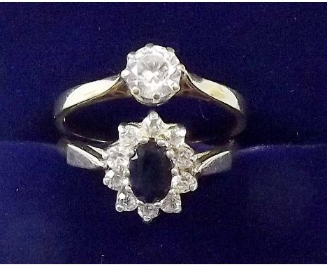 A 9 carat gold sapphire and white stone dress ring size N, and a solitaire cubic zircon ring - size O