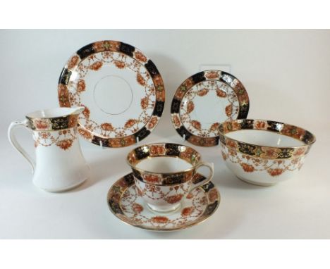 A Royal Albert Edwardian tea service with floral swag decoration comprising five cups and six saucers, milk, sugar and six te