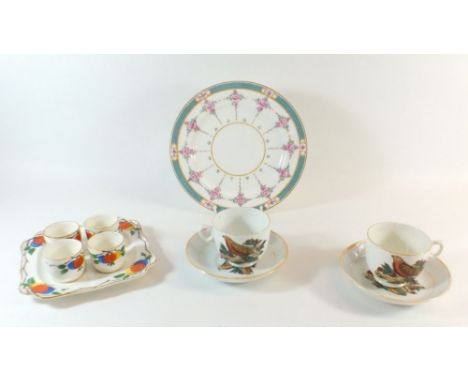 A pair of Victorian cups and saucers printed Christmas Robin, a Minton's plate and an Art Deco egg cup set