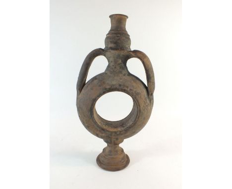 A Roman ring shaped terracotta vase with two handles - 29cm high