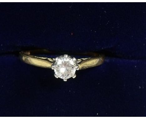 An 18 carat gold diamond solitaire ring - size N