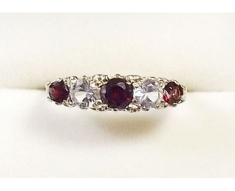 A 9 carat gold garnet and white stone ring - size N 1/2