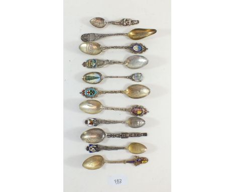 A quantity of silver and enamel spoons