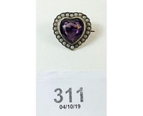 A silver heart cut amethyst brooch with seed pearl surround