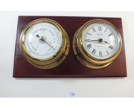 A Bentima mahogany mounted clock and barometer