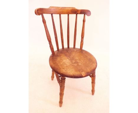 A vintage beech stick back chair