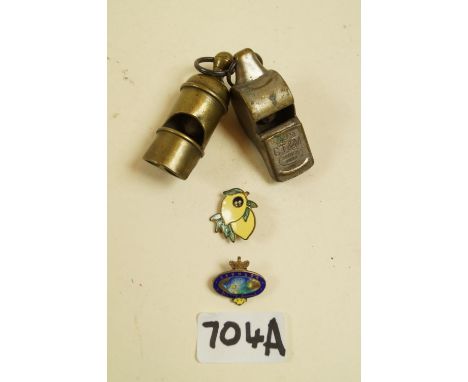 A CT &amp; M 202 whistle and a Victorian brass whistle, a Robertson pre-war lemon Golly badge by H W Miller and sterling silv