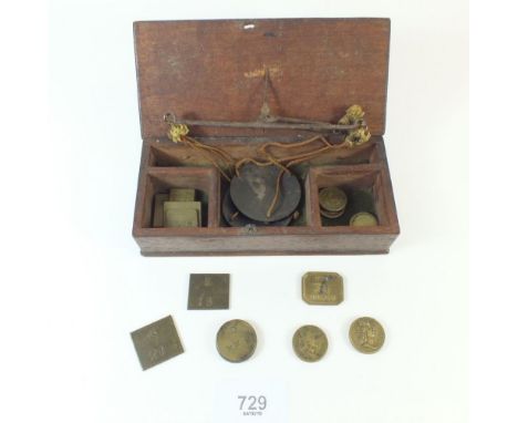 A set of gold scales including coin weights - boxed