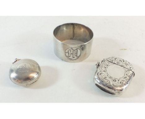 A silver vesta Birmingham 1897, silver sovereign case Chester 1889 and a silver napkin ring.,  total weight 63 grams.