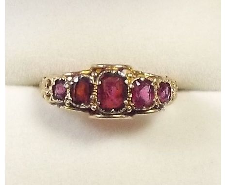 A Victorian 15 carat gold ring set five graduated rubies - size N 1/2