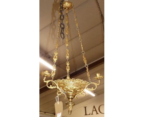 An early 20th century French gilt metal hanging three-branch ceiling light raised on suspended shades with candle sconces, ap