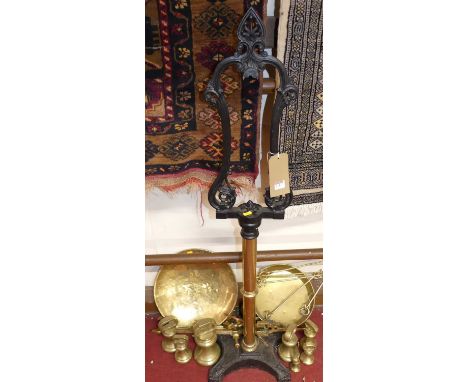 An early 20th century set of brass and cast iron floor scales, with graduated weights 