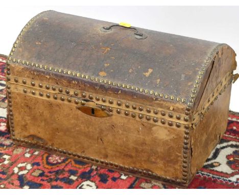 A 19th century tan leather clad and brass studded domed hinge top table chest, the paper lined interior with label for EYRE t