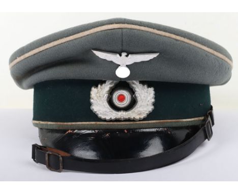 WW2 German Infantry NCO’s Peaked Cap, example produced in a doeskin wool cloth. White piping to the crown and bordering the c