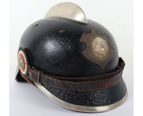 German Fire Brigade Helmet, leather bodied pickelhaube style helmet body with comb top and white metal trim to the front and 