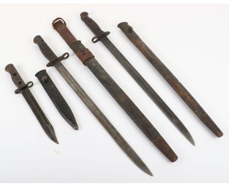 British 1907 Bayonet, untouched example with two piece wooden grips. Housed in its leather and steel mounted scabbard. Blade 