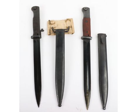 WW2 German K98 Combat Bayonet, with replaced wooden grips, blued pommel and housed in blued scabbard with the frog stud stamp