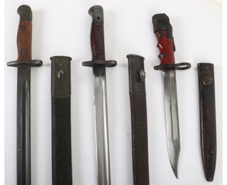 Australian 1907 Bayonet by Lithgow, with two piece wooden grips, housed in leather scabbard with steel mounts. Blade stamped 