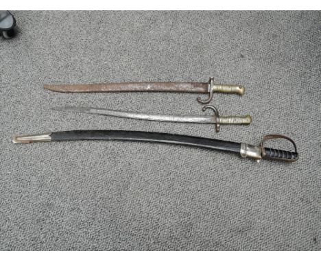 A French Chassepot 1868 Bayonet having French engraved inscription dated 1868, blade numbered 74992, with metal scabbard numb