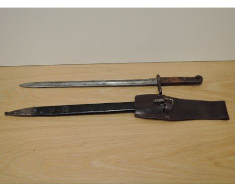 A German/Belgian Mauser Export Bayonet with leather scabbard, blade marked PV3155, blade length 39cm, overall length 52cm