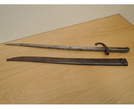 A French Chassepot Bayonet with scabbard, guard numbered 6864 scabbard numbered T70363, blade length 57cm, overall length 69c