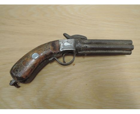 A Six Barrel Percussion Pepperbox Pistol having wood &amp; metal decorated grip, decorated side plates, no makers or proof ma