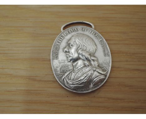 A 18th/19th century restike of the 1650 Dunbar Medal, bust of Cromwell looking left and legend The Lord of Hosts Word.At.DVNM