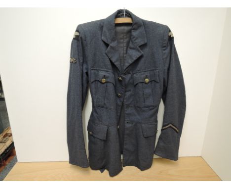 A WWII Ladies W.A.A.F Jacket, size no14, dated 1945 with buttons &amp; cloth badges, one button missing