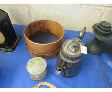 A wooden sieve together with a small pot and a silverplated teapot